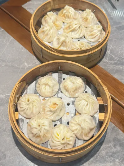 Stacked bamboo steaming baskets at a Shanghai dumpling shop
