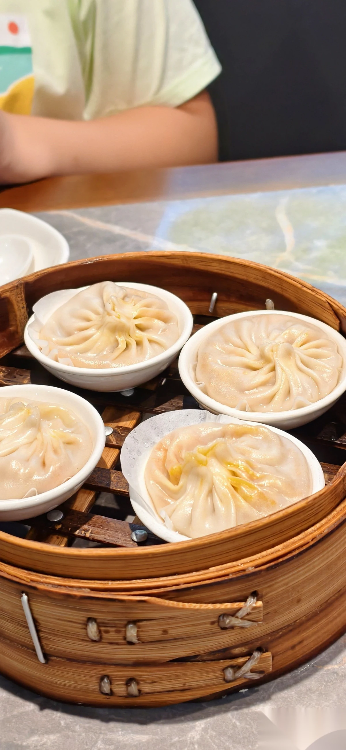 A bamboo basket of crab xiaolongbao at Lai Lai